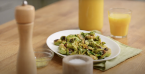 Orange and honey glazed brussels sprouts on a plate